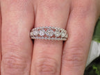 .20ct bezel set natural round brilliant diamond ring in 10K white gold on a ladies finger.