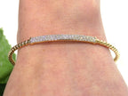 .50ct total weight natural diamond flex bracelet in 10K yellow gold on a ladies wrist.