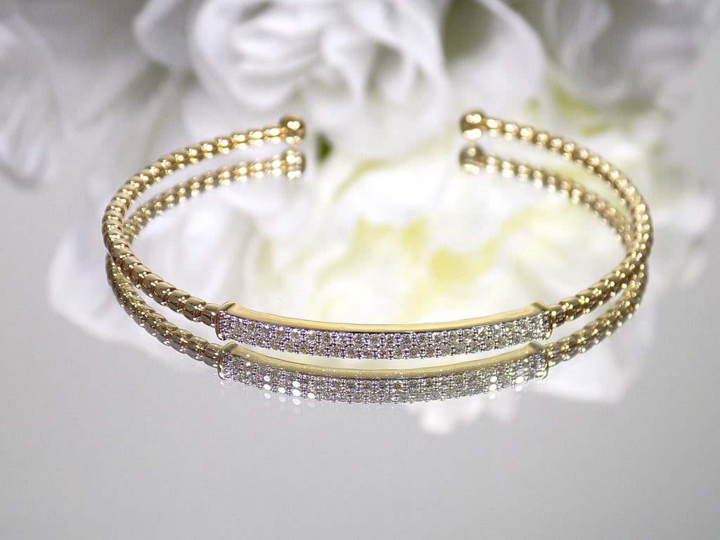 .50ct total weight natural diamond flex bracelet in 10K yellow gold.