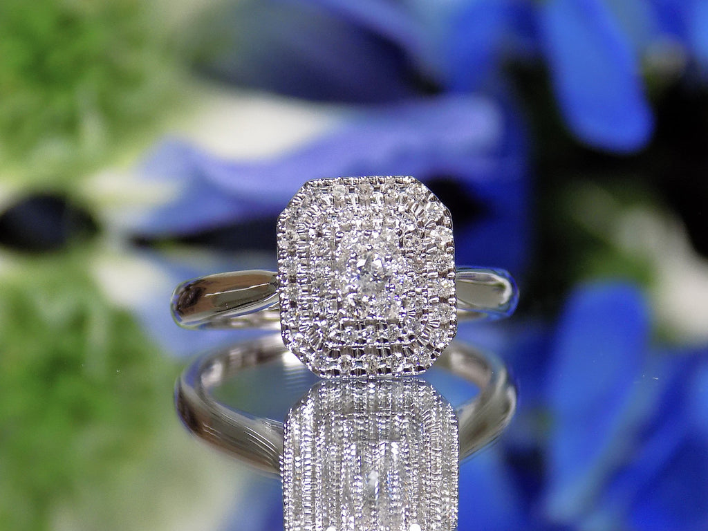 .50ct total weight natural diamond cluster ring in 10K white gold.