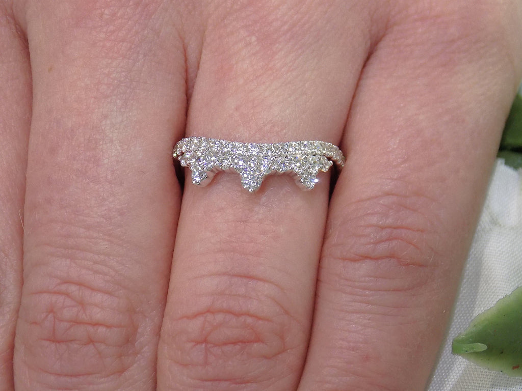 .63ct total weight natural round brilliant diamond tiara style ring in 14K white gold on a ladies finger.