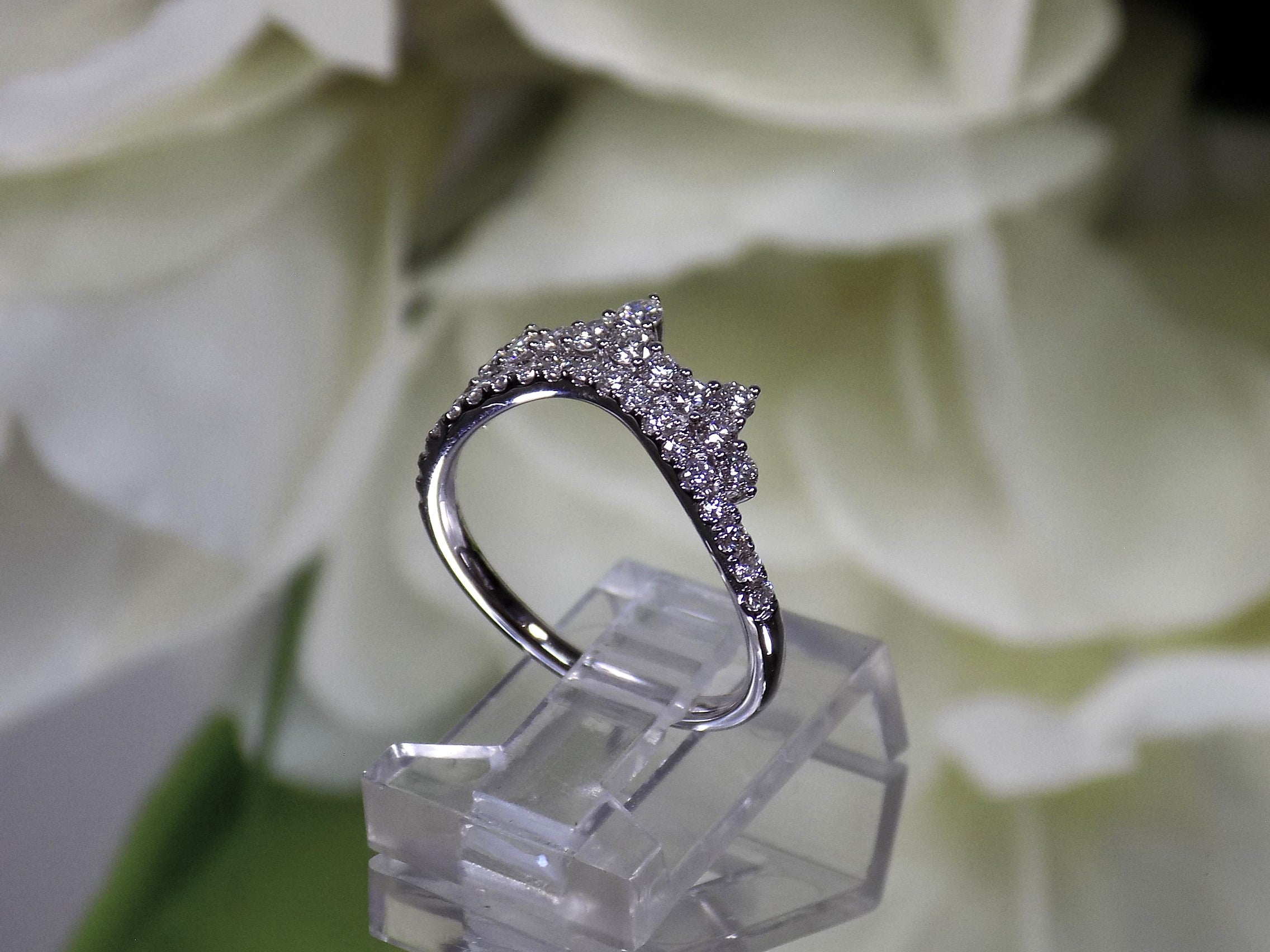 .63ct total weight natural round brilliant diamond tiara style ring in 14K white gold. Side view.