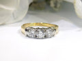 1.00ct total weight 3 stone natural diamond ring in 2 tone 14K yellow and white gold. Traditionally called a past, present, future ring.
