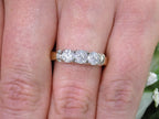 1.00ct total weight 3 stone natural diamond ring in 2 tone 14K yellow and white gold. Traditionally called a past, present, future ring on a woman's finger.