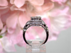 1.00ct total weight natural round diamonds cluster double halo ring in 14K white gold. Side view.