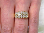 This is a women's vintage 2-row natural diamond ring with 1.00ct total weight of diamonds in 14K yellow gold on a woman's finger.