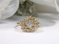 This is 1.20ct total weight natural diamond cluster cocktail ring in 14K yellow gold on a white background.