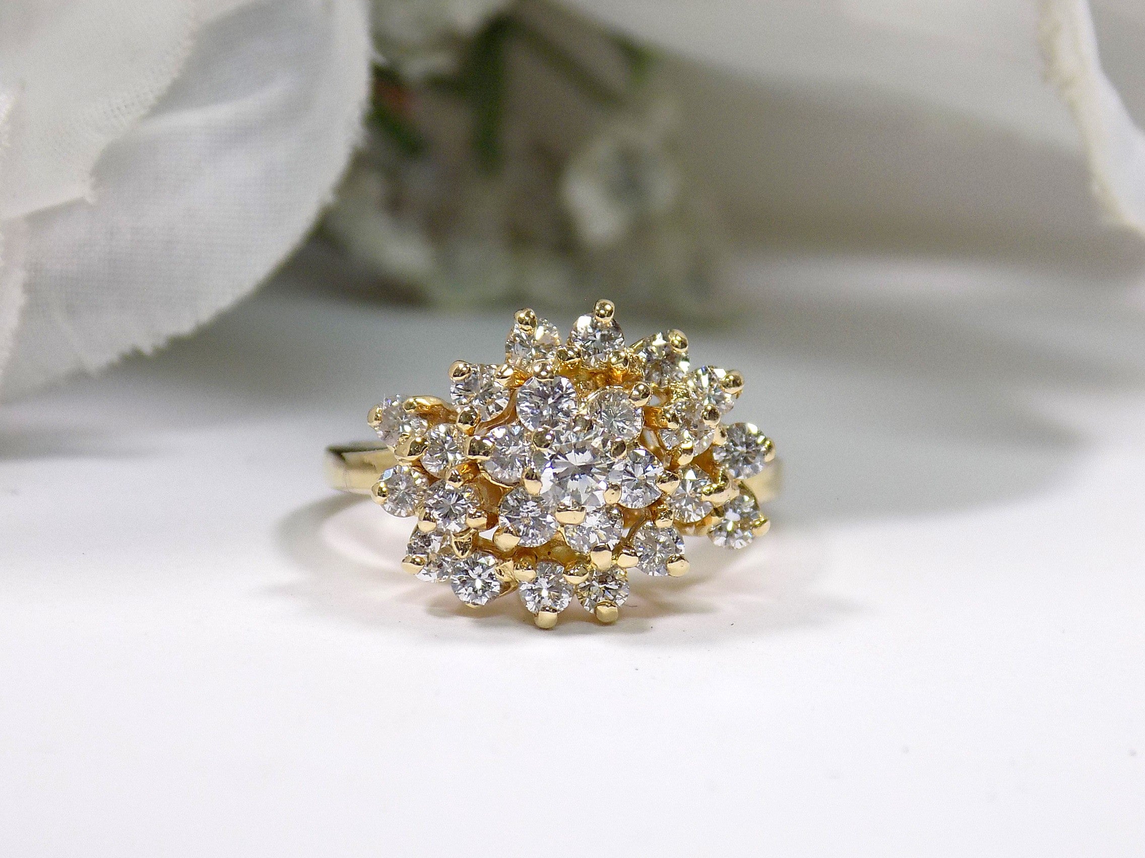 This is 1.20ct total weight natural diamond cluster cocktail ring in 14K yellow gold on a white background.