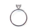 This is a side view of a straight line style 1.39ct total weight natural round brilliant diamond ring in white gold shown with a white background.