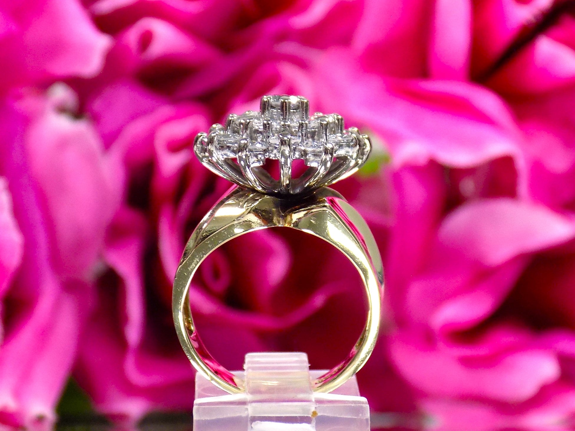 This is a side view of a women's 1.50ct total weight natural diamond 2-piece wedding set with the engagement ring and matching diamond band shown with a flowery background.