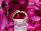 This is the matching band that goes with a women's 1.50ct total weight natural diamond 2-piece wedding set in yellow gold shown with a flowery background.