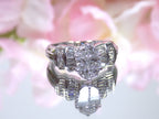 This is a 1.50ct total weight natural diamond ring in white gold from our estate collection shown with a pink mirrored background.