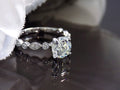 This is women's 1.72ct total weight natural round diamond engagement ring in white gold with black mirrored background.