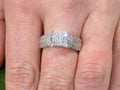 This is a 1.00ct total weight natural diamond ring in white gold shown on a woman's finger.