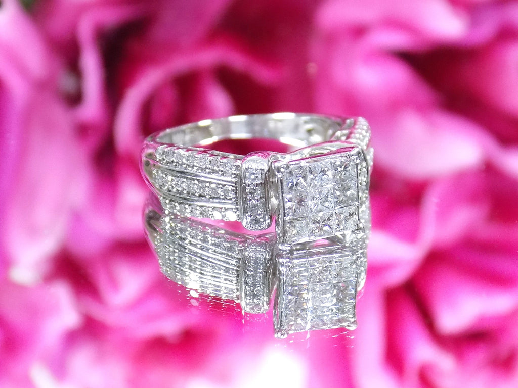 This is a 1.00ct total weight natural diamond ring in white gold shown with a pink floral background.
