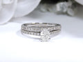 This is a natural 1ct total weight oval shape diamond bridal set with engagement ring and matching band in white gold with a white background.
