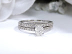 This is a natural 1ct total weight oval shape diamond bridal set with engagement ring and matching band in white gold with a white background.