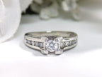 This is a 1ct total weight natural round diamond ring in white gold with a white background.