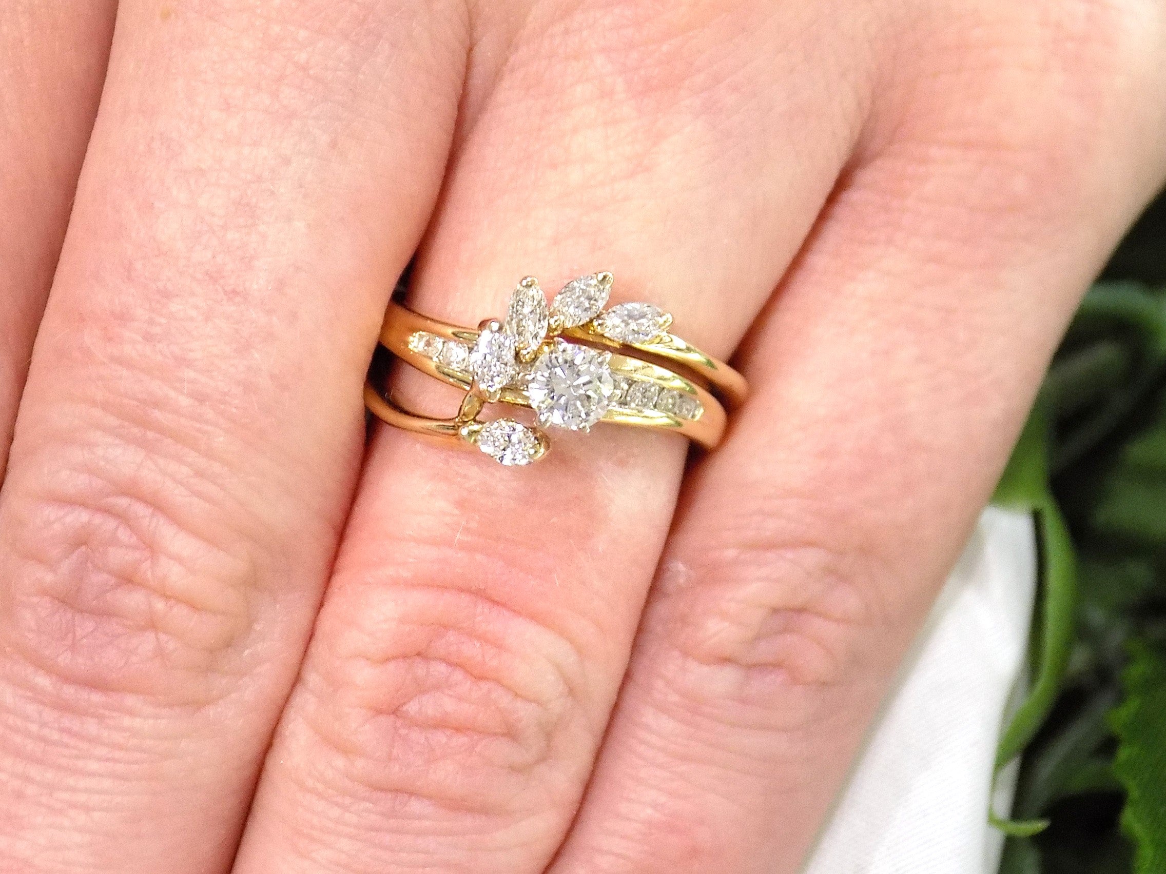 This is a custom 2-piece set with a matching band .77ct total weight with .25ct center round brilliant diamond in 14K yellow gold on a ladies finger.
