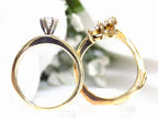 This is a custom 2-piece set with a matching band .77ct total weight with .25ct center round brilliant diamond in 14K yellow gold on a white background side view.