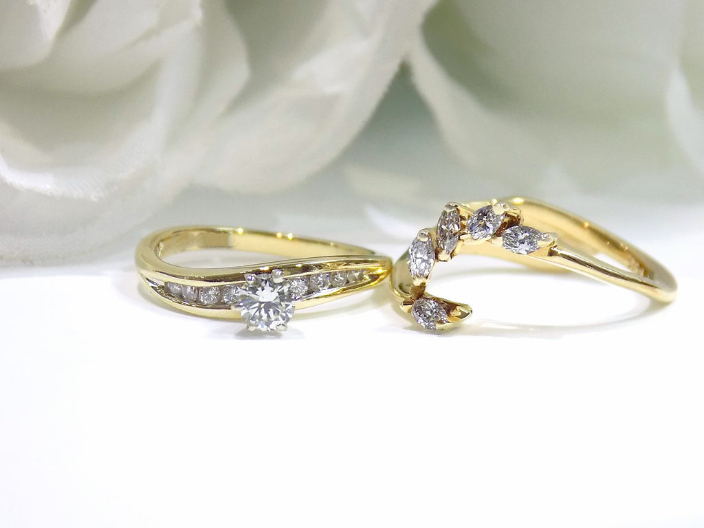 This is a custom 2-piece set with a matching band .77ct total weight with .25ct center round brilliant diamond in 14K yellow gold on a white background.