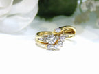This is a custom 2-piece set with a matching band .77ct total weight with .25ct center round brilliant diamond in 14K yellow gold on a white background.
