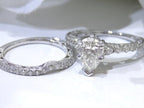 This is a women's 2-piece wedding set including the engagement ring and a matching band with a 1.51ct natural pear shape diamond center plus 1.64ct in natural diamond accents shown side by side on white background.