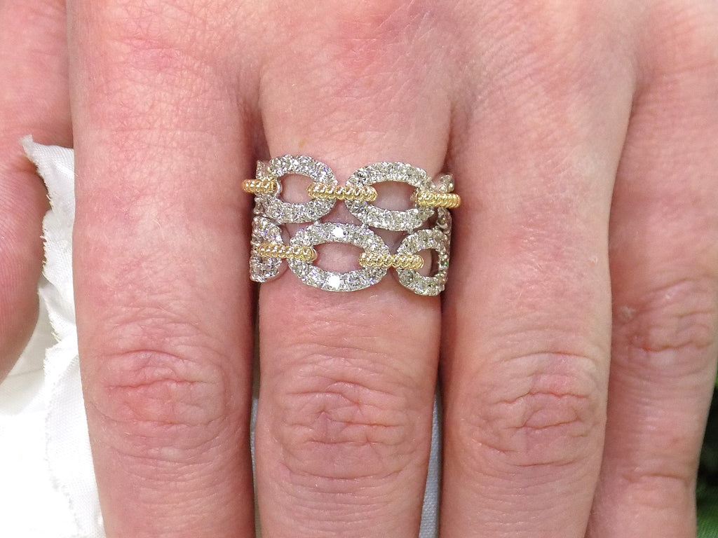 1.50ct double row two tone white and yellow gold natural diamond band on a ladies finger.