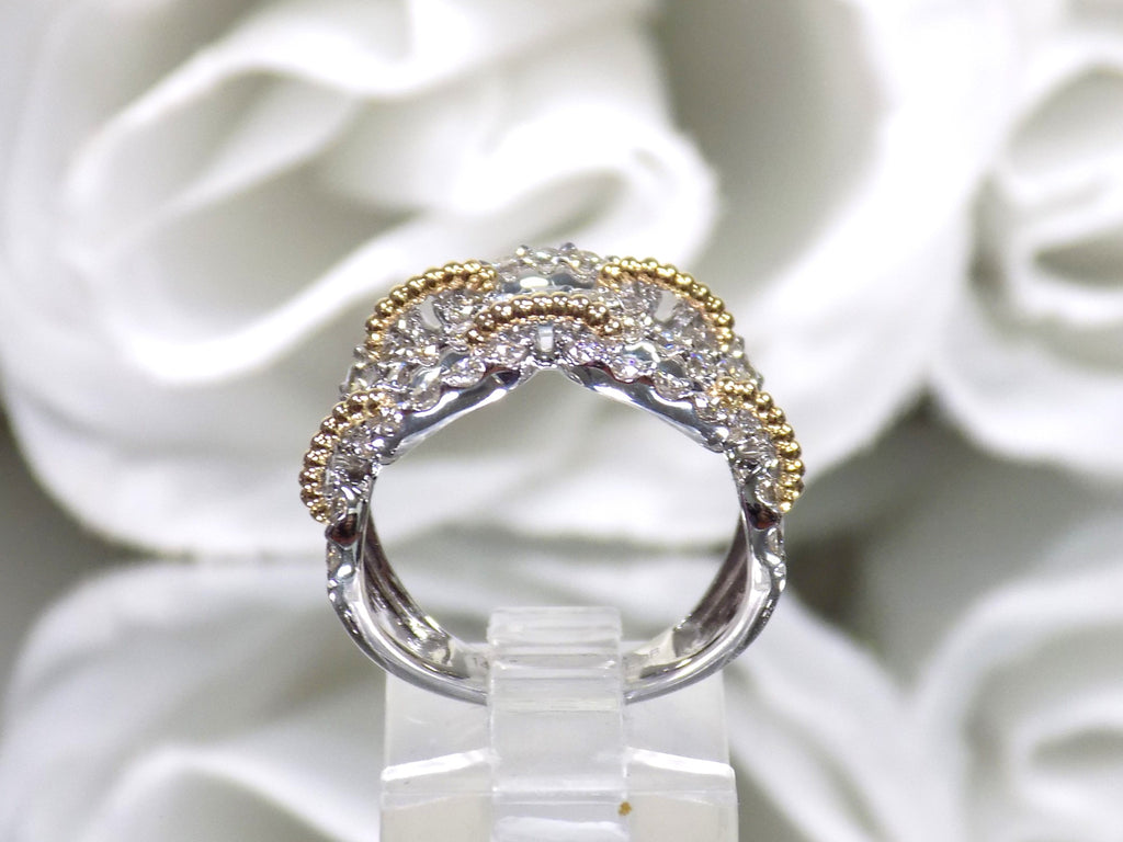 1.50ct double row two tone white and yellow gold natural diamond band from a side view.