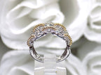 1.50ct double row two tone white and yellow gold natural diamond band from a side view.