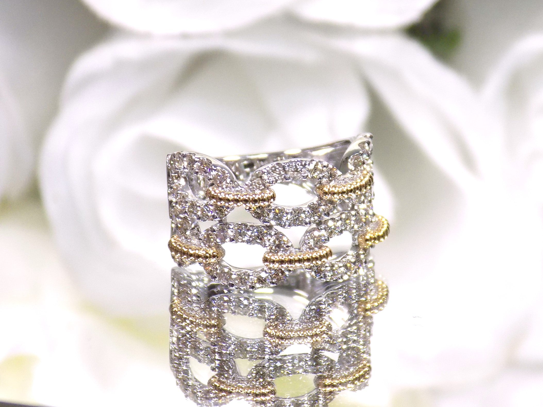 1.50ct double row two tone white and yellow gold natural diamond band.