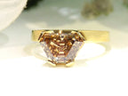 This is a 3.06ct natural GIA certified custom shield cut fancy chocolate diamond solitaire ring in yellow gold with a white background.