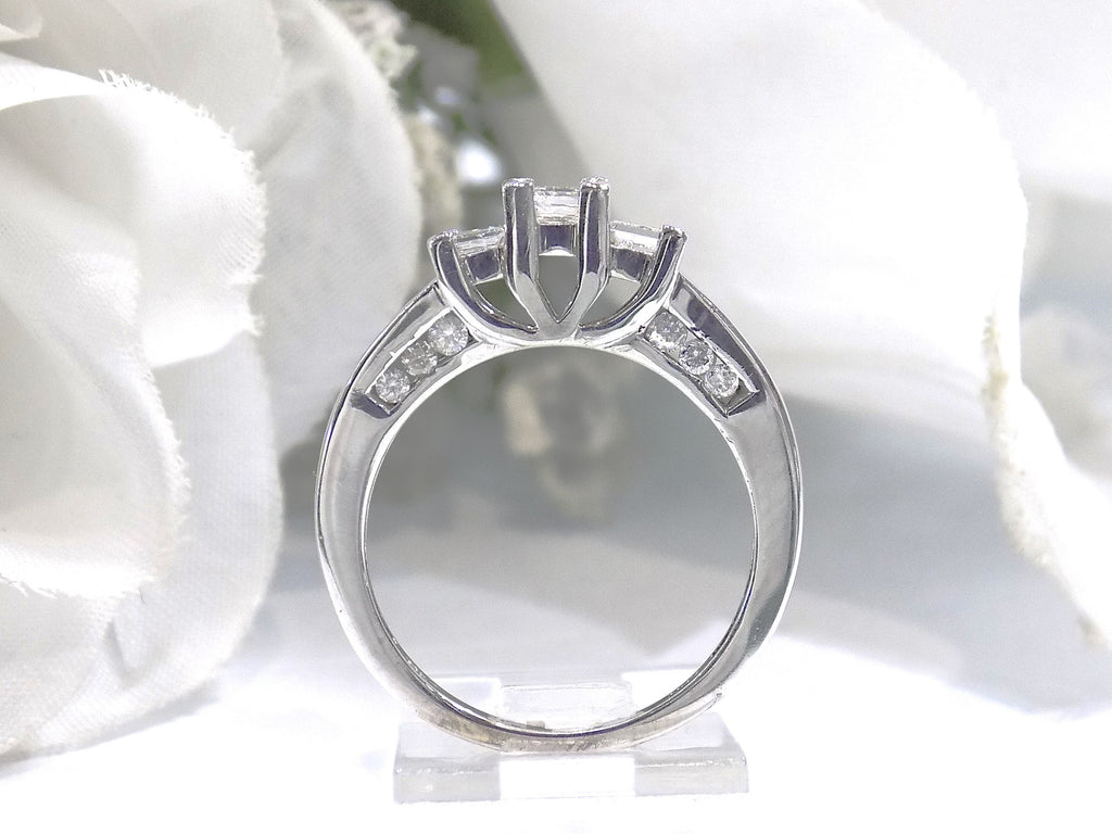 This is a side view 3-Stone style .75ct total weight natural princess cut diamond ring in white gold with white background.