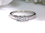 3-Stone natural diamond ring in white gold.