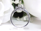 Side view of a 3-stone natural diamond ring in white gold.