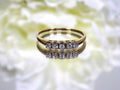 Preowned or estate small 5-stone natural diamond band in yellow.