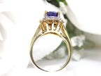 This is a women's estate LeVian ring with a 3.50ct total weight sapphire and diamonds set in 14K yellow gold with a floral background.