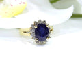 This is a women's estate LeVian ring with a 3.50ct total weight sapphire and diamonds set in 14K yellow gold with a floral background.