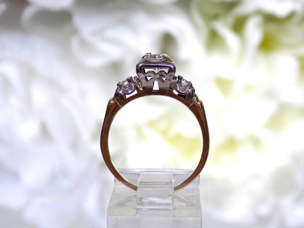 This is a Vintage .59ct ladies natural diamond wedding ring in yellow gold from a side view.