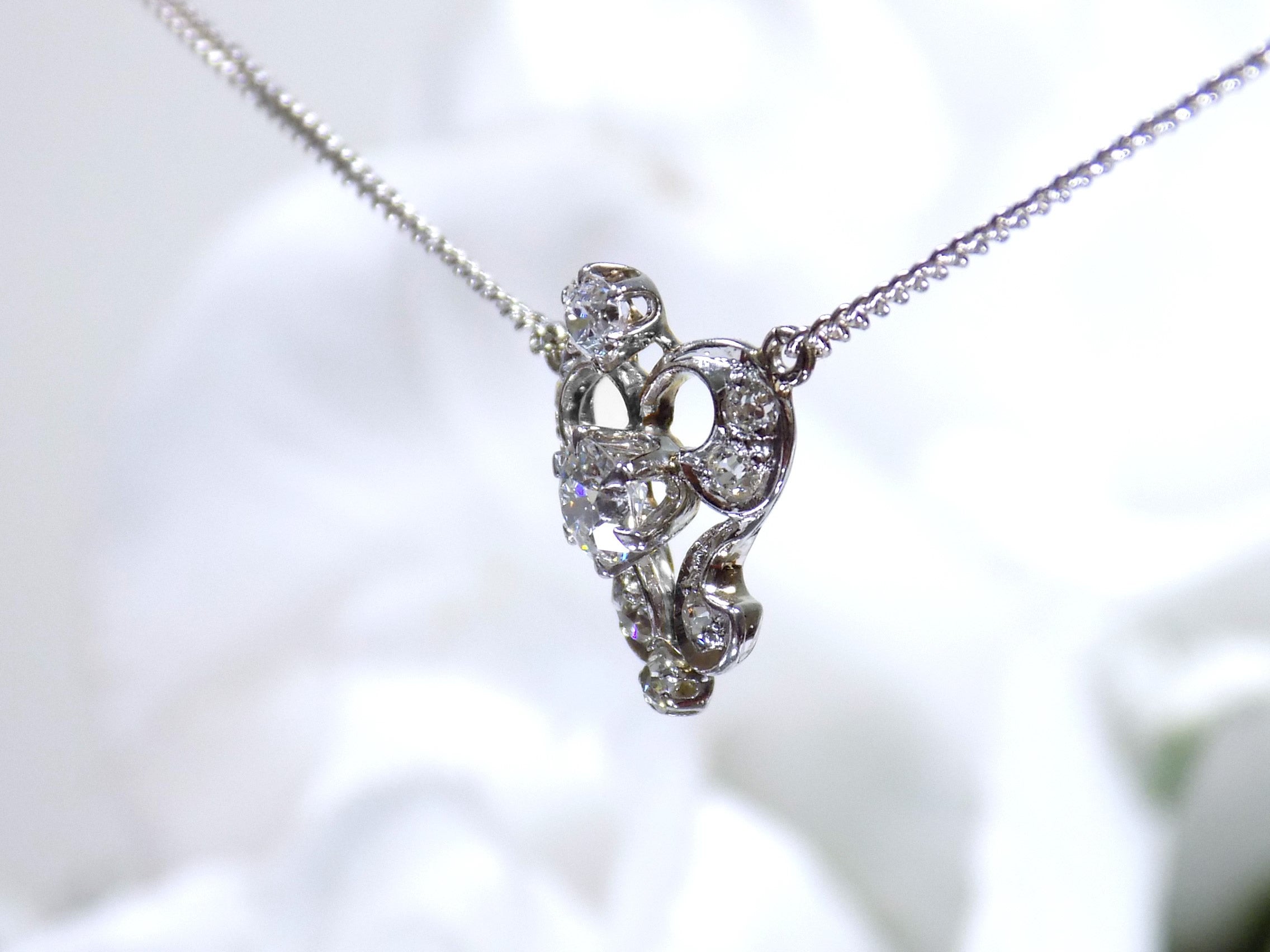 Antique .66ct total weight custom diamond necklace in 18K white gold side view. circa 1900 