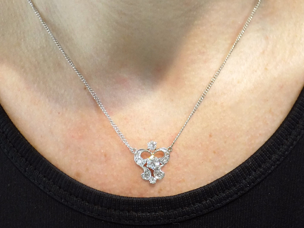 Antique .66ct total weight custom diamond necklace in 18K white gold. circa 1900 on a ladies neck.