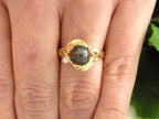 This a genuine black pearl ring in yellow gold from our estate collection fully restored to like new condition shown on a woman's finger.