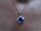This is a women's ballerina/halo style pendant with a near perfect 2.04ct natural cushion cut tanzanite surrounded by a total weight of 1.06 natural baguette diamonds on a women's neck.