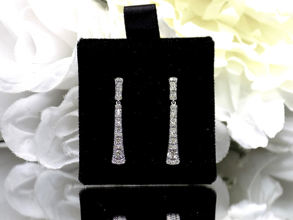 .33ct total weight natural diamond dangle earrings in 10K white gold.
