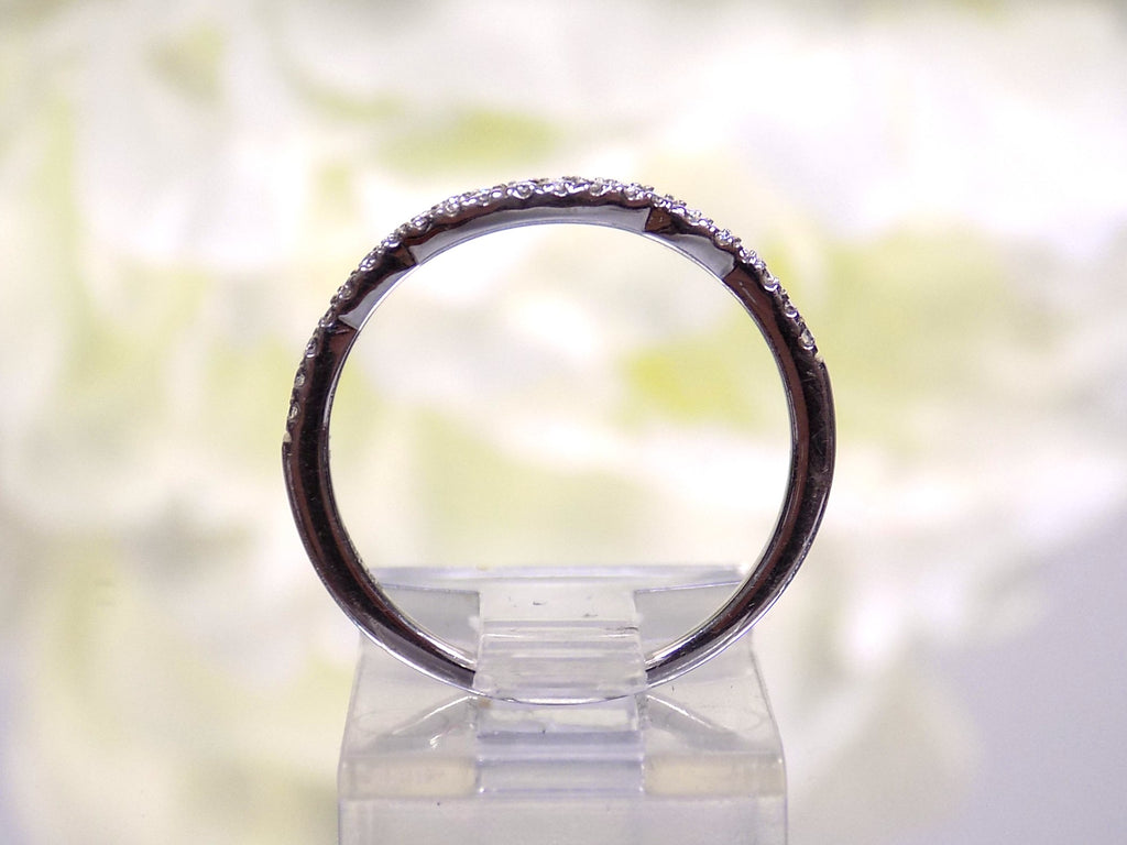 This is a side view of just the matching band that goes with a women's 2-piece wedding set which includes the engagement ring and matching band weighing 1.02ct in natural diamonds in white gold with rose gold accents on a white background