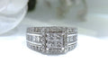 2.00ct total weight natural diamond princess cut, round, and baguette ring in 14K white gold.