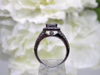 2.00ct total weight natural diamond princess cut, round, and baguette ring in 14K white gold in a side view.