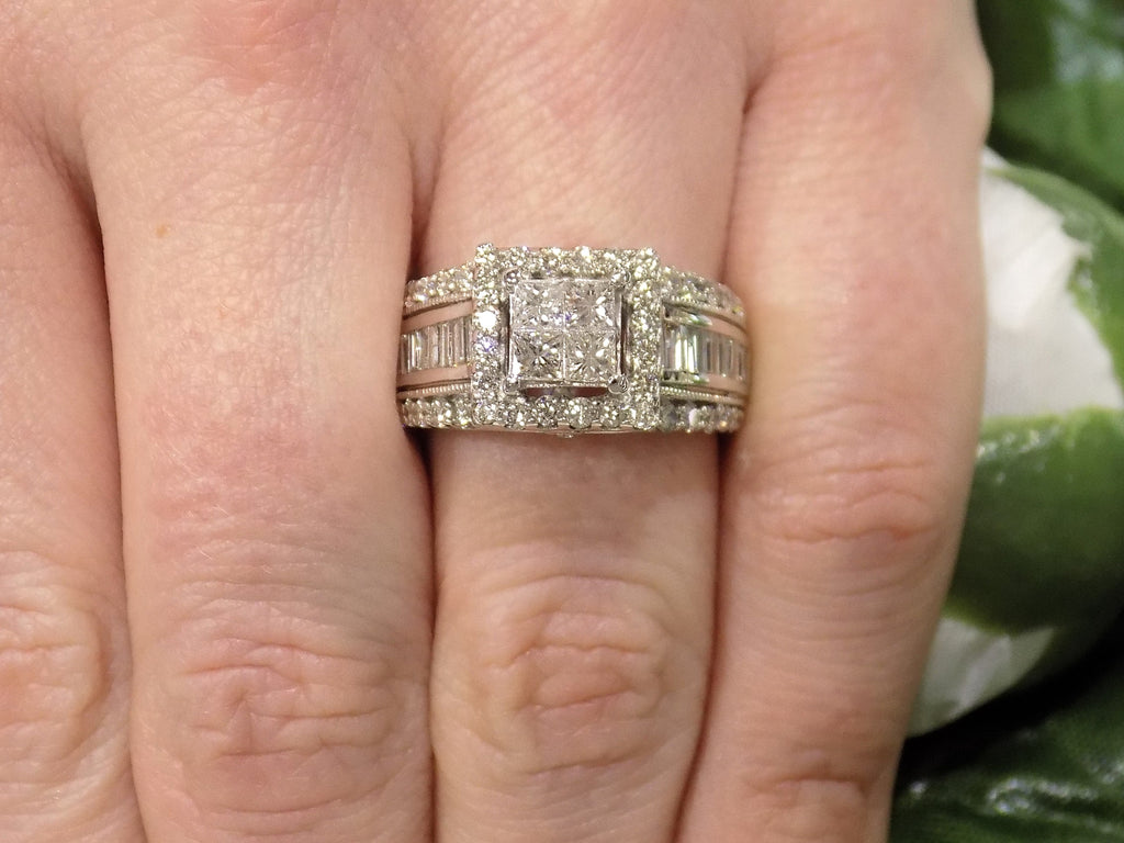2.00ct total weight natural diamond princess cut, round, and baguette ring in 14K white gold on a woman's finger.