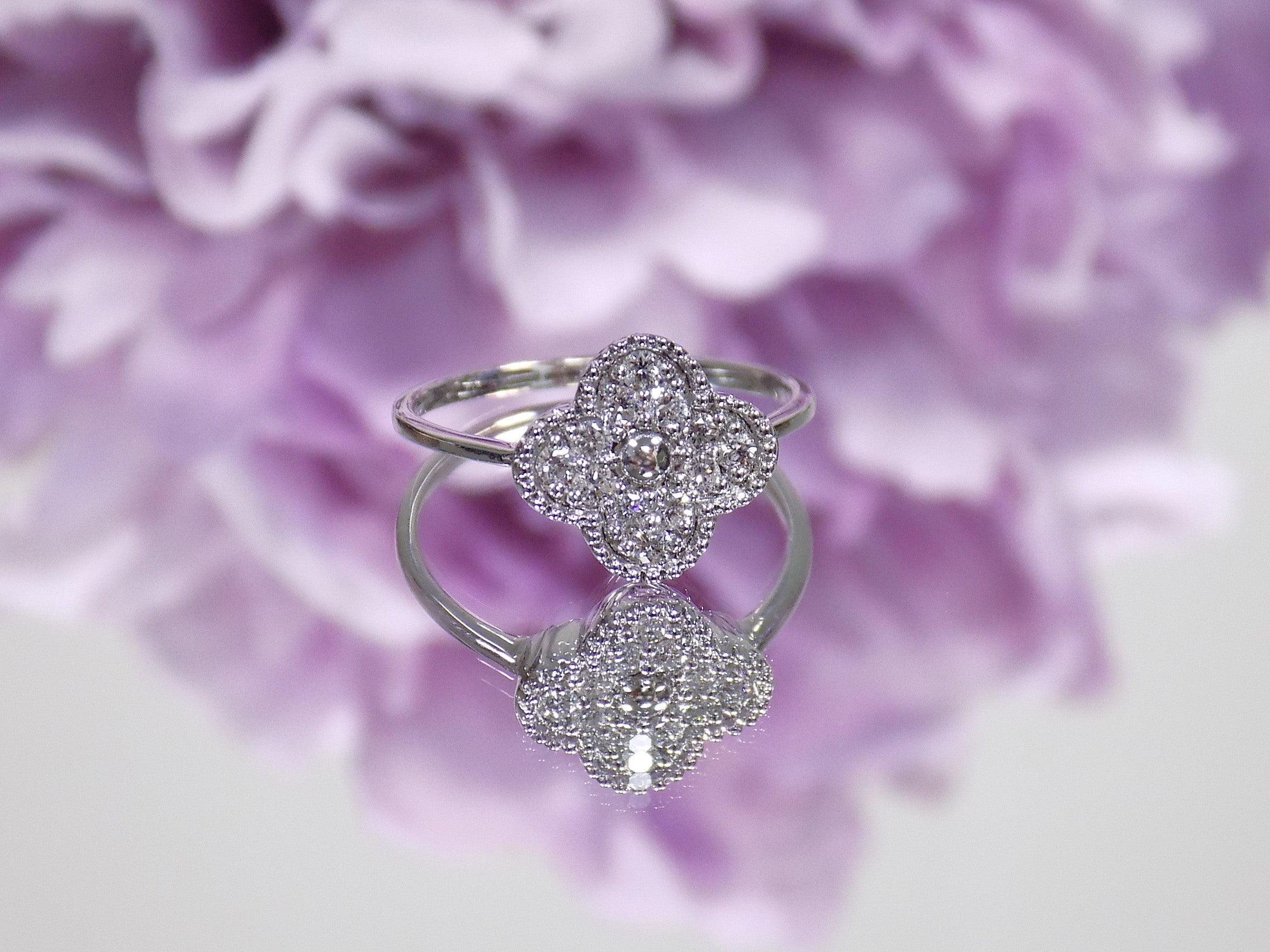 This is a Natural Diamond Van Cleef Style White Gold Ring.