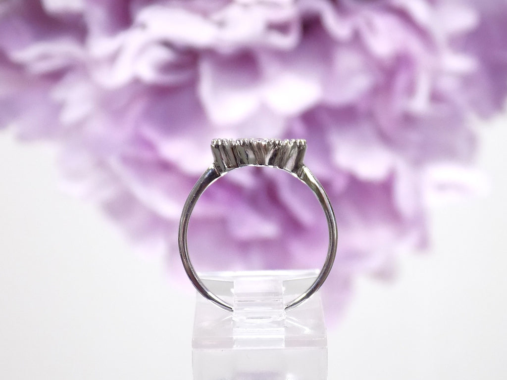 This is a Natural Diamond Van Cleef Style White Gold Ring side view.